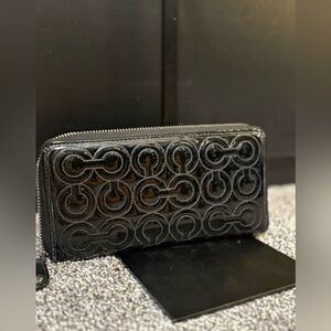 Coach black signature embossed patent leather accordion zip wallet